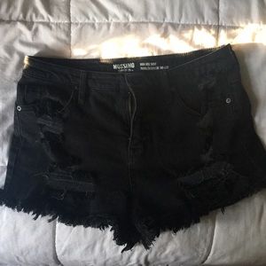 Distressed black jean shorts